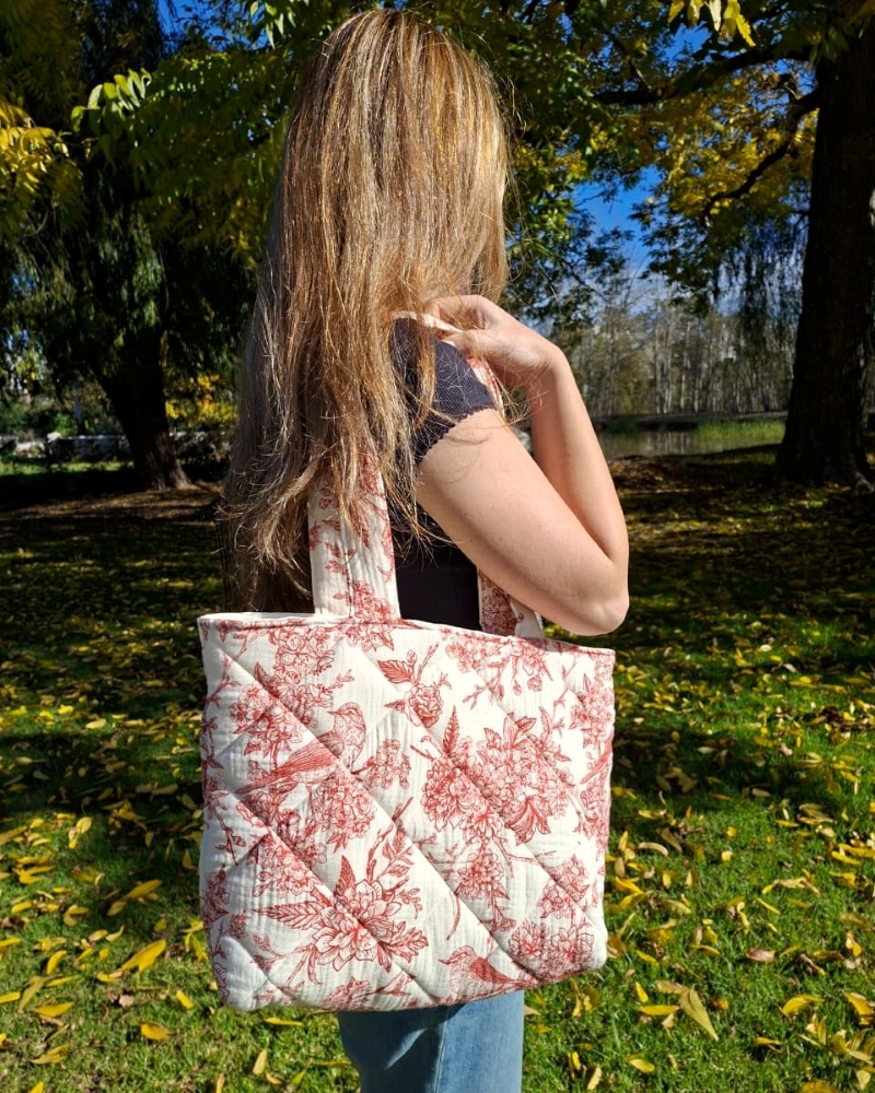 A cozy flat-lay of handmade crochet items in soft warm tones